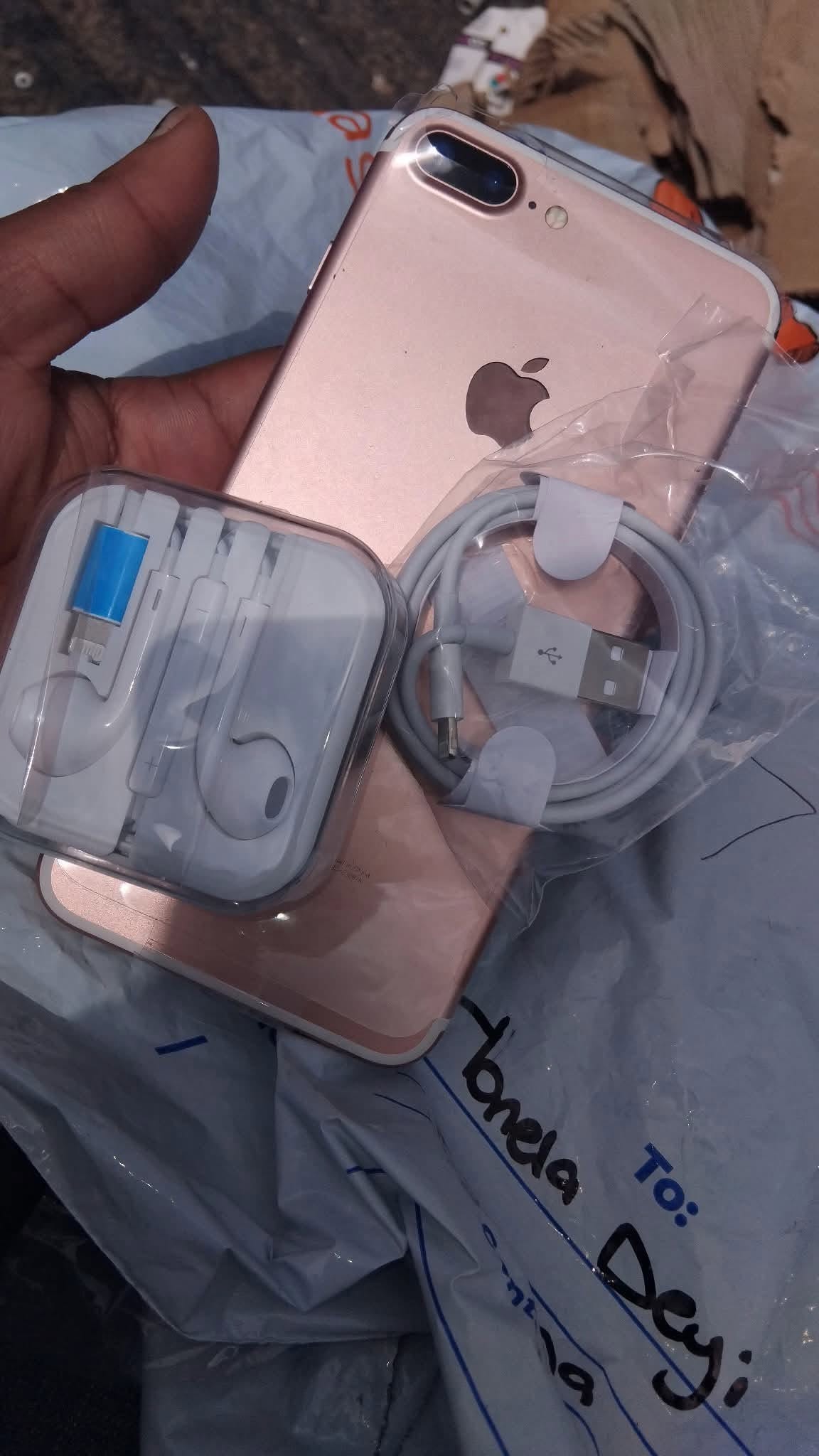 iPhone with earphones and cable — a real Yonnie Dee product shot